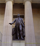 George Washington Statue at Wall Street... New York City In 1913 the year Morgan died (to be succeeded by his son Morgan Jr.) the company built a new bank on the corner it has occupied by 1873-one of Wall street's most valuable sits. With skiscrapers rising on all sides and landvalues skyrocketing, the house of Morgan displayed its fabulous wealth by building its new headquarters no taller than the old-just four stories, trough with foundations strong enough to support a forty-story tower if needed some day