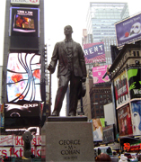George M. Cohan was a famous figure in the New York City theater scene. Little Johnny Jones, his first big Broadway hit introduced his songs "Give My Regards To Broadway" and "The Yankee Doodle Boy". His statue was errected in the 1960s in recognition of musical contributions to the war effort through his songs "You're a Grand Old Flag" and "Over There."